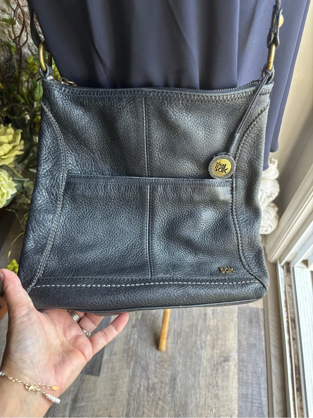 The Sak Black Leather Pebbled Crossbody with Gold Accents